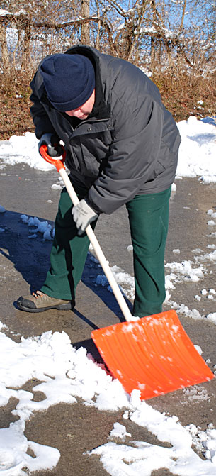 Billy Schulz shovels snow